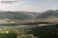 Вид с вершины г. Чалпан. Вдалеке виден город, Абаканский рудник, отвалы, ТЭЦ.
